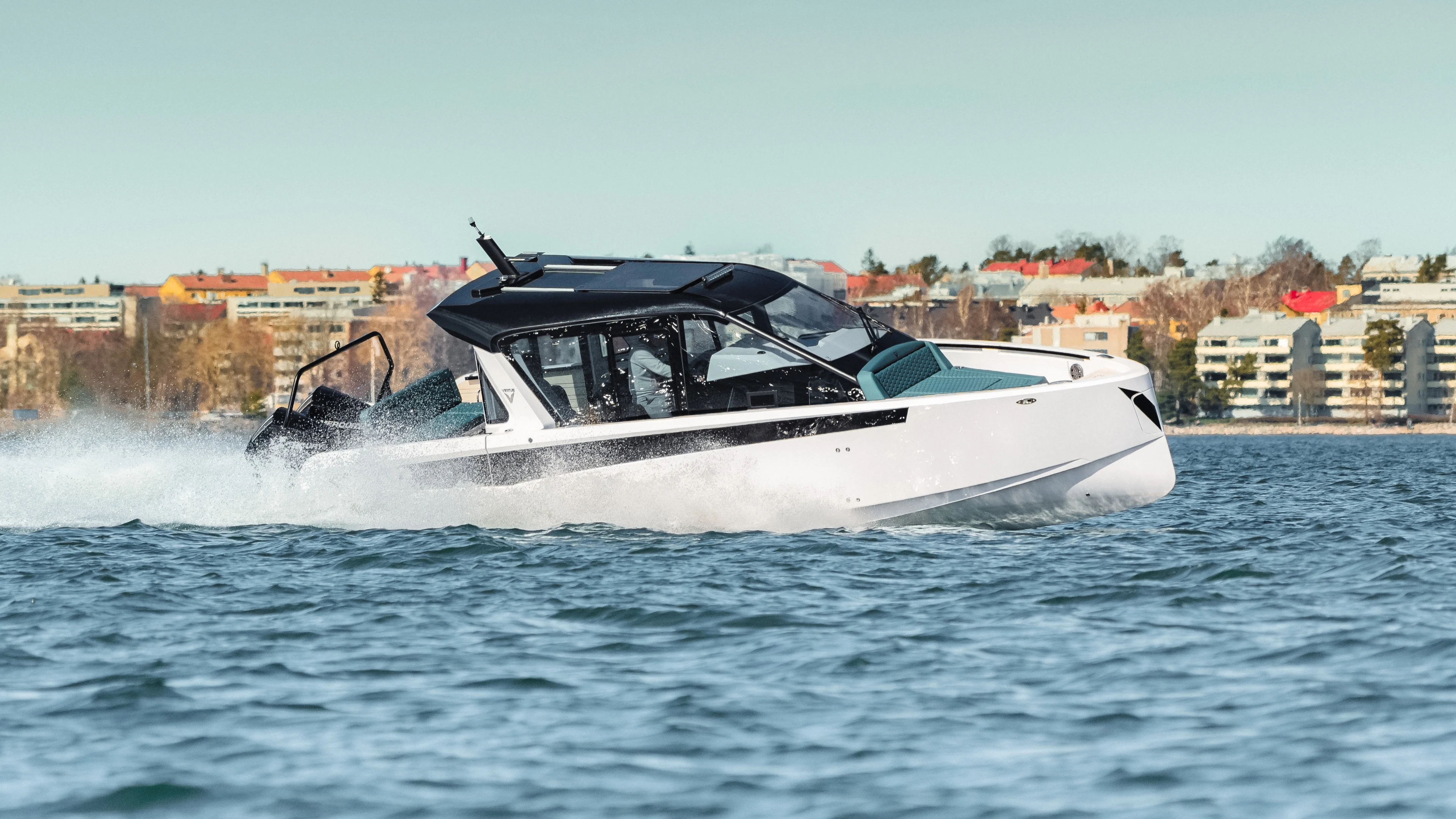 Virtue Yachts V10 Cabin performance dayboat with enclosed wheelhouse.