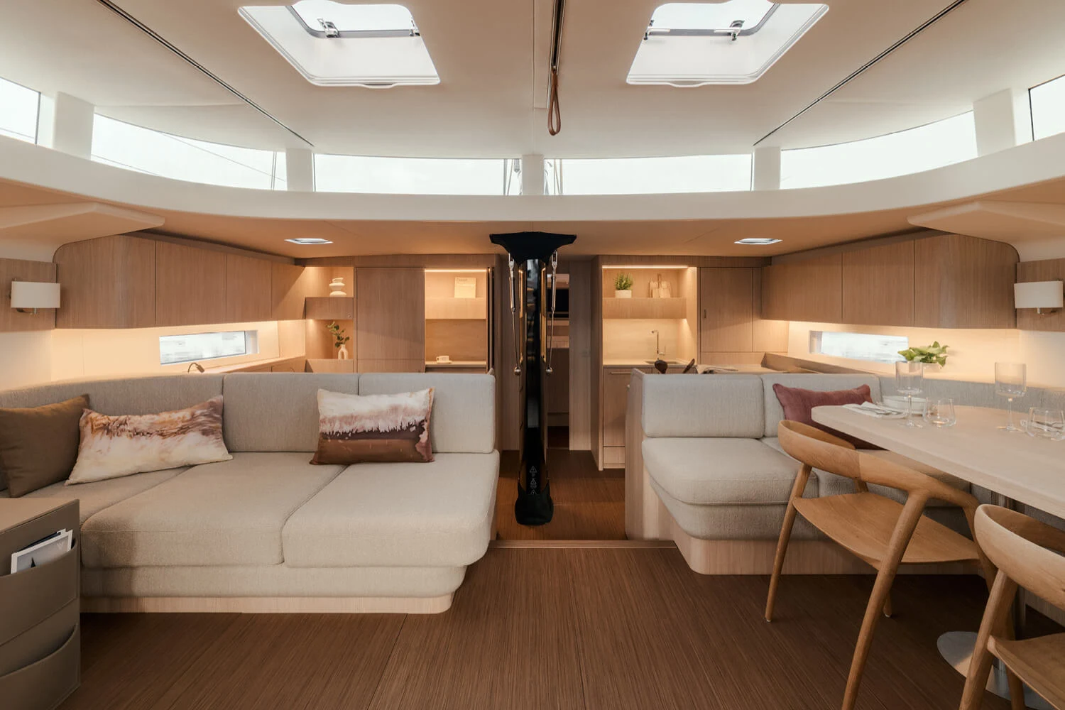 The new YYachts Y7 saloon with timber finishes, seating and dining space.